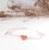 Obrazek Bransoletka różowe serce  na jedwabnej nici
